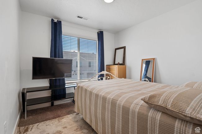 Carpeted bedroom with visible vents | Image 12