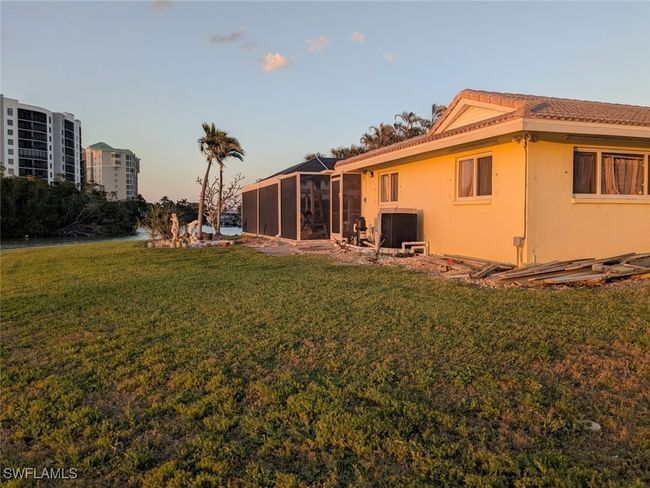 View of yard with a sunroom | Image 6