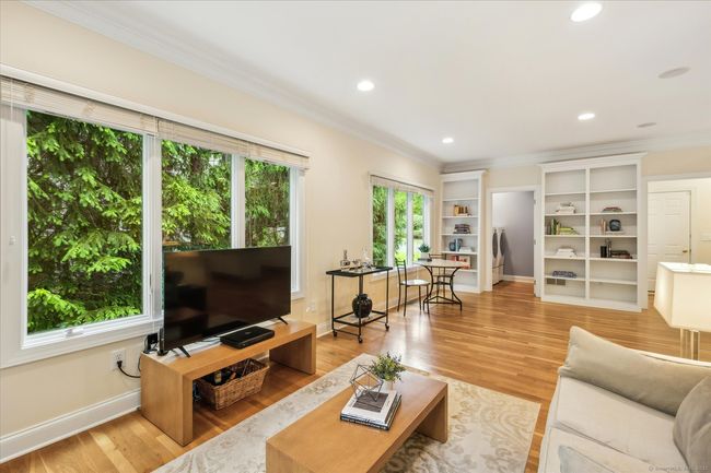 Family room with an abundance of natural light. | Image 9