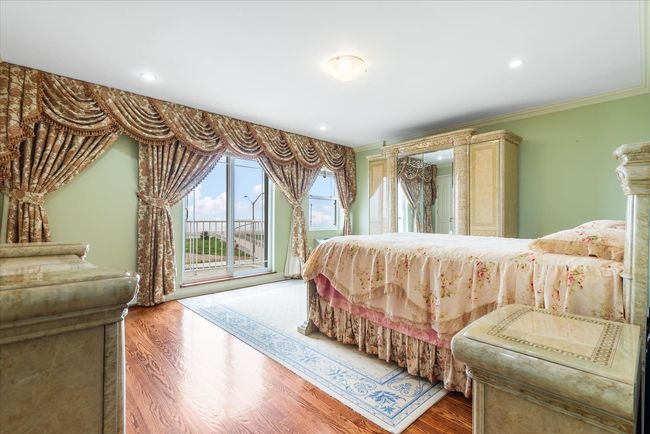 Bedroom with access to outside, recessed lighting, wood finished floors, and crown molding | Image 9