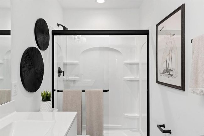 Bathroom featuring vanity and an enclosed shower | Image 10