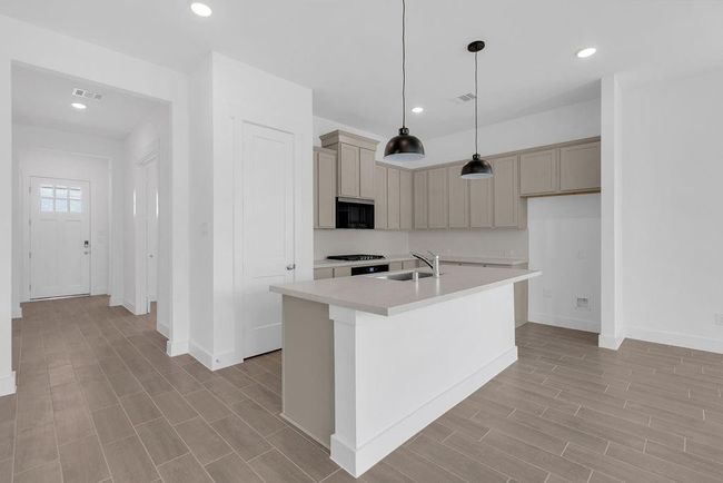 With its seamless layout and airy design, the kitchen invites effortless cooking, conversation, and connection. | Image 4