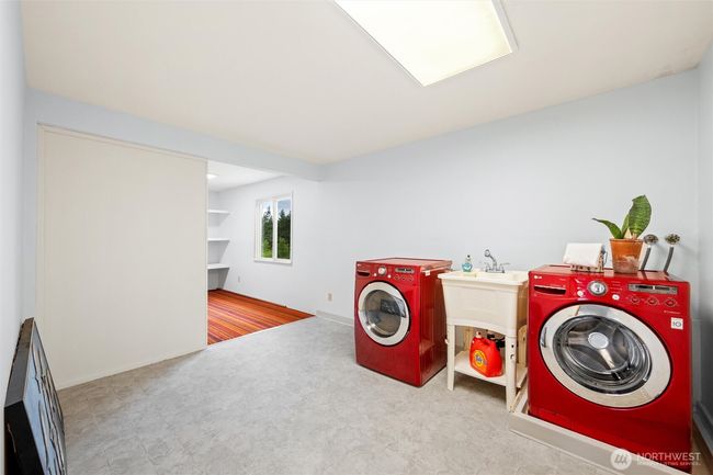An oversized laundry room prefect for additional washer and dryers. | Image 29