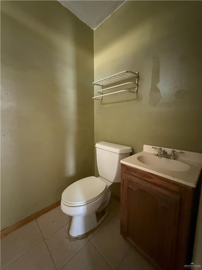 Bathroom featuring vanity, tile patterned floors, and toilet | Image 21