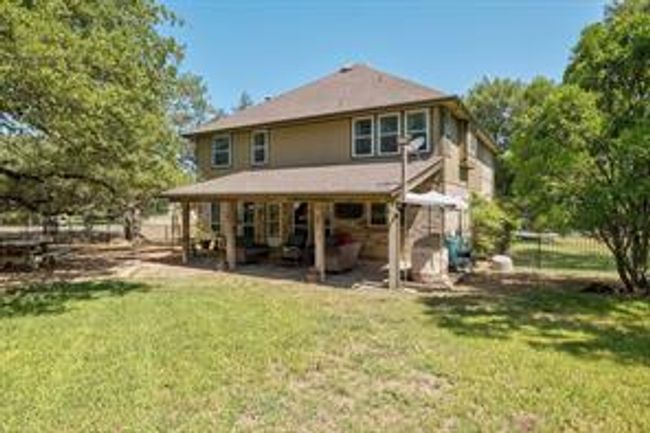 Rear view of property with a lawn | Image 35