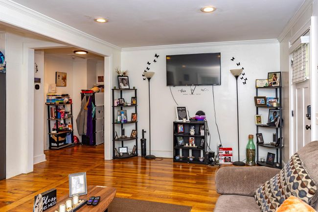 Living room featuring recessed lighting, ornamental molding, and wood finished floors | Image 4