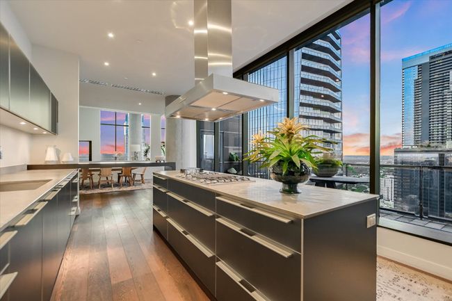 Custom cabinetry offers sleek storage solutions while maintaining a clean, modern aesthetic. | Image 14
