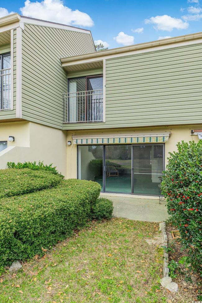 Rear view of house featuring a balcony and stucco siding | Image 27