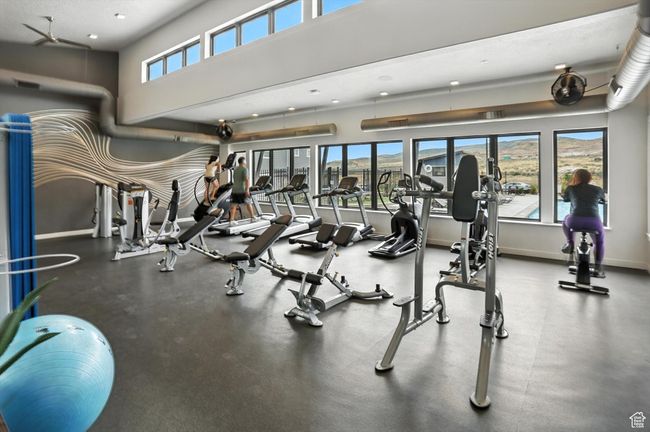 Gym with recessed lighting and large windows | Image 22