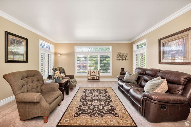 Living room featuring crown molding and baseboards | Image 28