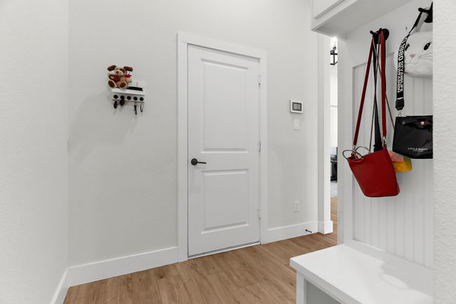 Mudroom with light wood-style floors and baseboards | Image 21