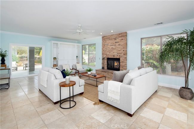 Family room with gas fireplace and access to the backyard | Image 22