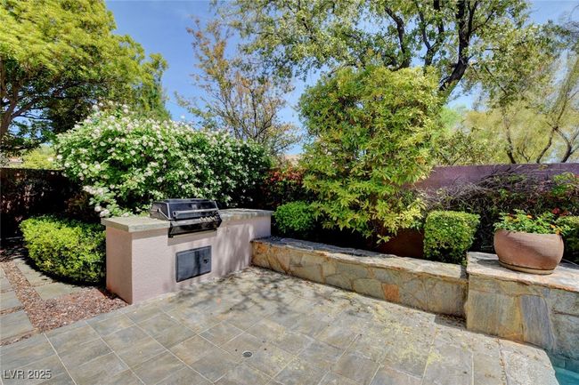 View of patio featuring fence, area for grilling, and exterior kitchen | Image 47