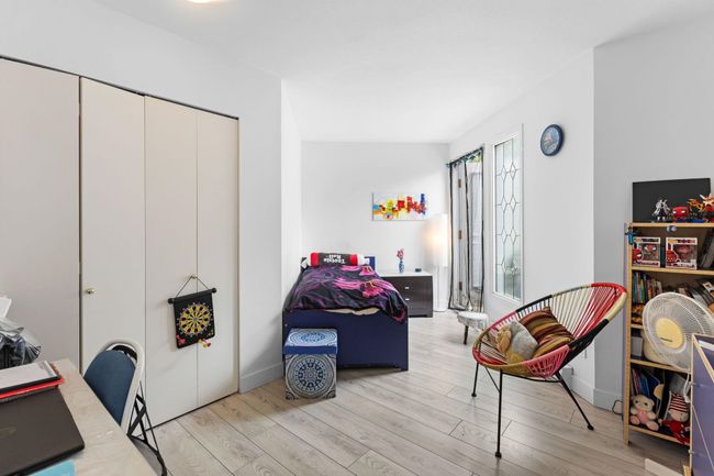 Bedroom with light wood-type flooring and a closet | Image 23