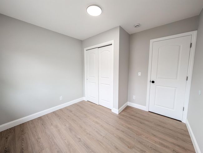Unfurnished bedroom featuring light wood-style floors, baseboards, and a closet | Image 17