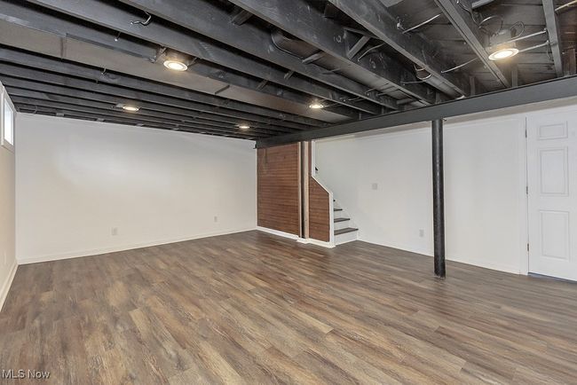 Basement featuring hardwood / wood-style flooring | Image 39