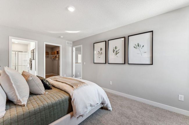 Bedroom #3 of 4 on upper level is a "Princess Suite" and has an attached HUGE walk in closet AND its own bathroom. Gorgeous! Jameson floor plan. Photo of previously built home; finishes, selections, colors, and floorplan to vary. | Image 31