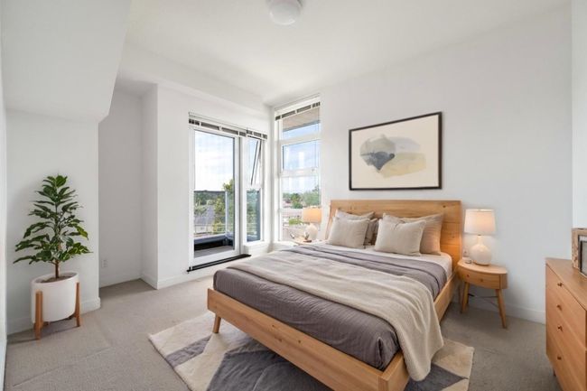 Bedroom with light colored carpet and baseboards | Image 5