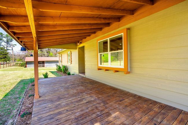 Wooden deck featuring a yard | Image 14