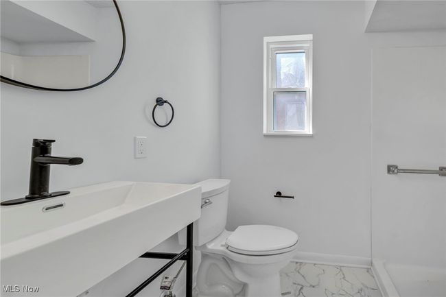 Bathroom with vanity, marble finish floor, baseboards, and toilet | Image 13