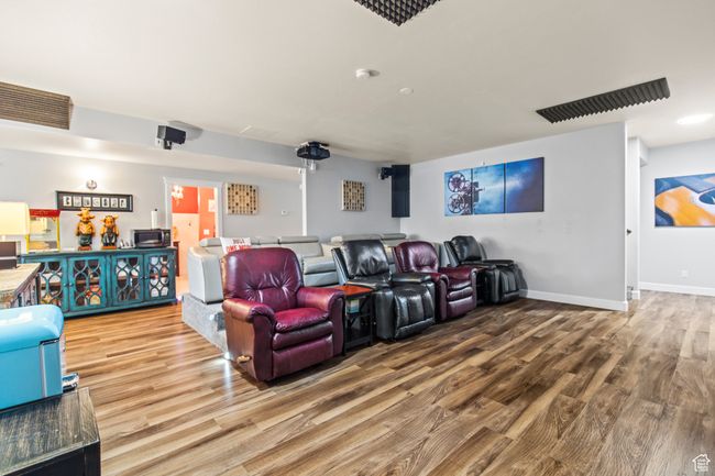 Cinema room with wood-type flooring | Image 62
