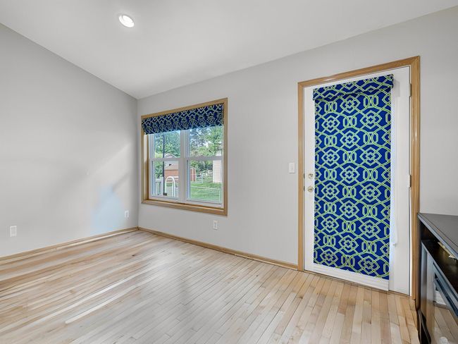 Main floor sunroom boasts wonderful natural light. | Image 18