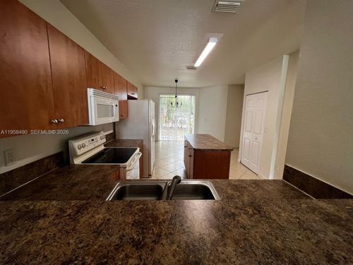 1909-1909 Hibiscus Ln, Riviera Beach, FL, 33404 | Card Image