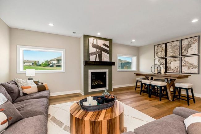 Lower level Rec area with 2 bedrooms and full bath. Photos of previous model home. Not actual listing. Features and sizes may vary. Contact agent for details & showings! | Image 22