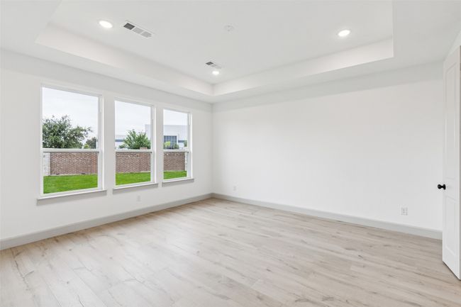 Your dreamy new owner's suite is located at the back of the home for additional privacy. | Image 11