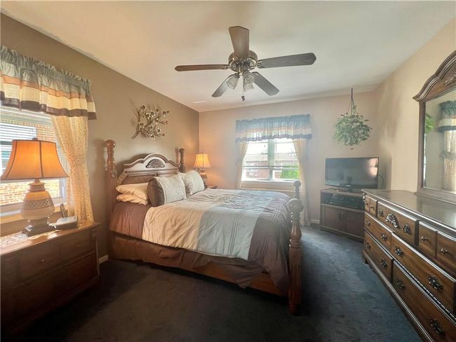 Primary bedroom featuring ceiling fan | Image 12
