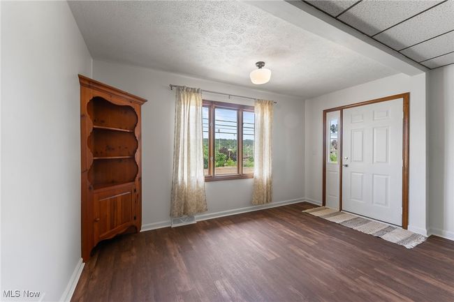 Entryway featuring wood finished floors and baseboards | Image 12