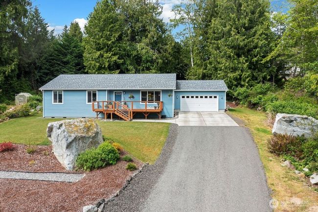 This picture perfect single level home with views and a quiet setting awaits in the well known Beach Club community. Relaxing and easy living. Enjoy an abundance of walking trails. Beach Club amenities. Port Ludlow is where you'll find the best of destinations! | Image 28