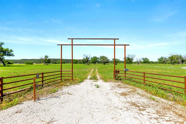 View of dirt / gravel road with a rural view | Image 18