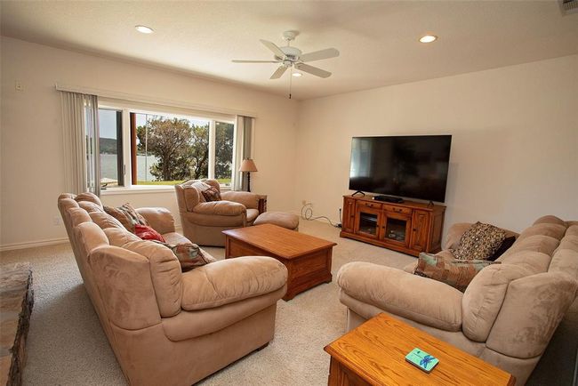 Recreation room with carpet, pool table, french doors, and a fireplace | Image 19