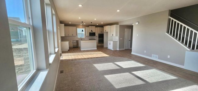 Open concept living with informal dining. Actual home shown. | Image 30