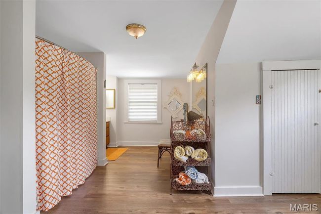Hall with wood finished floors and baseboards | Image 69