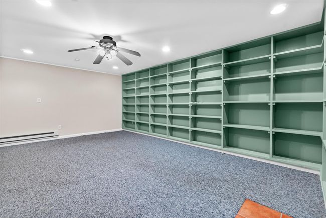 Empty room featuring recessed lighting, baseboard heating, ceiling fan, carpet, and baseboards | Image 25