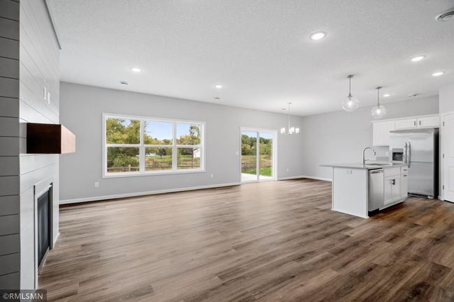 (Photo of previously finished home) Spacious family room filled with an abundance of natural light, creating a bright and cozy atmosphere. | Image 7