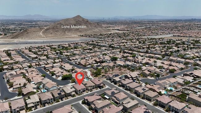 Aerial overview of property's location with a mountainous background and nearby suburban area | Image 66