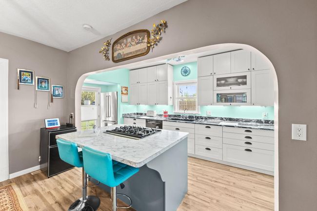 Kitchen features lots of natural light | Image 5