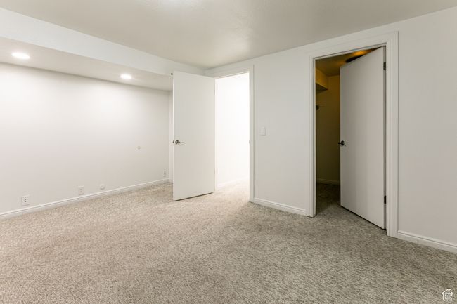 Unfurnished bedroom featuring light carpet, recessed lighting, and baseboards | Image 29