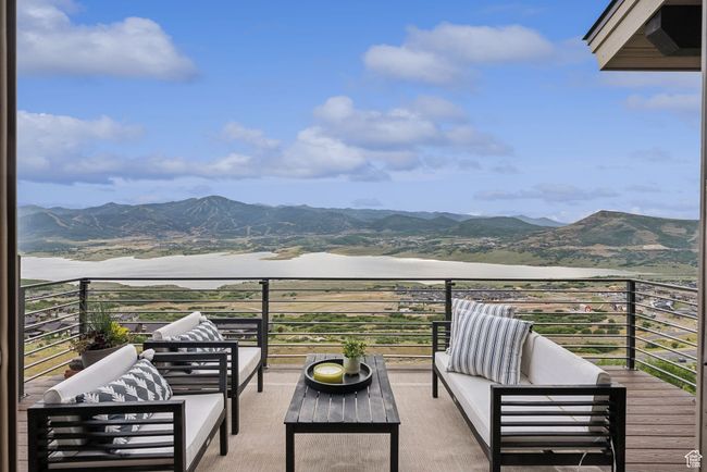 Balcony featuring a mountain view and outdoor lounge area | Image 58
