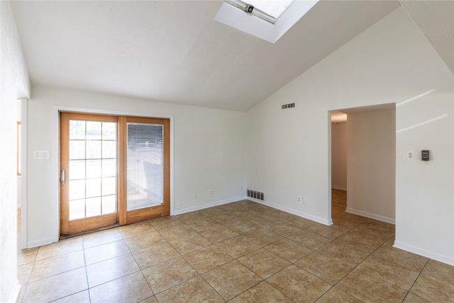 Living room offers french doors leading to back yard with pool and patio. | Image 15