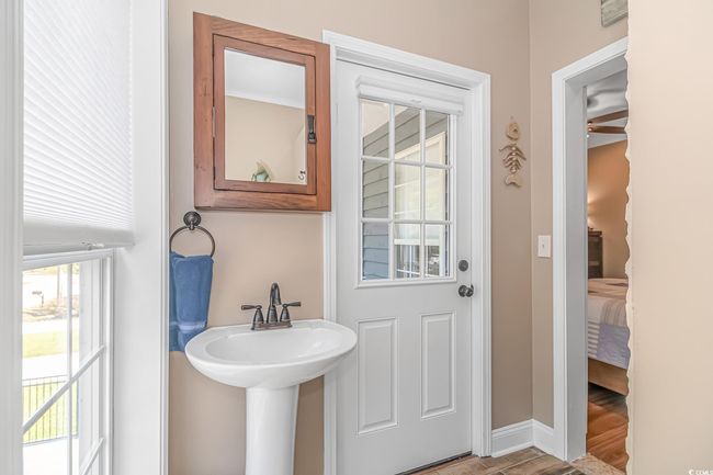 Ensuite bathroom with baseboards and wood finished floors | Image 17