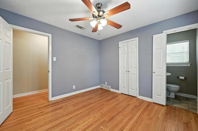 Unfurnished living room with light wood finished floors, ornamental molding, and a ceiling fan | Image 28
