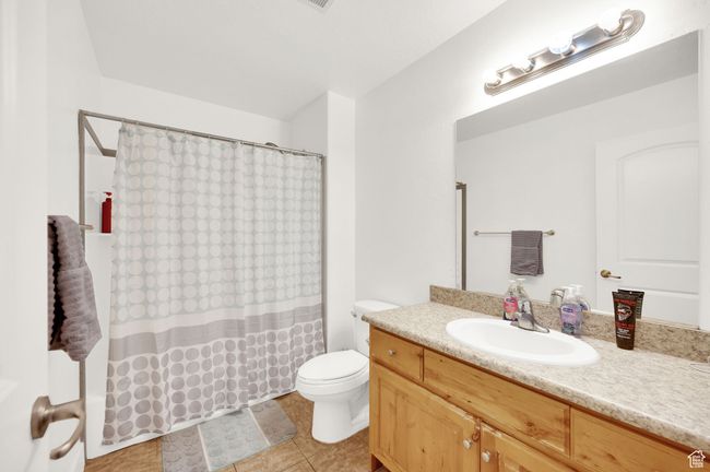 Bathroom with vanity and tile patterned floors | Image 12