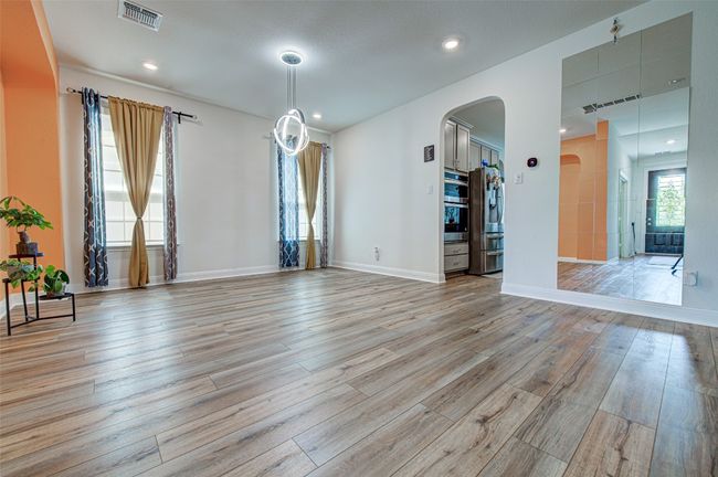 Formal Dining Room with arched wall, recessed lights & decorative chandelier - First Floor | Image 6