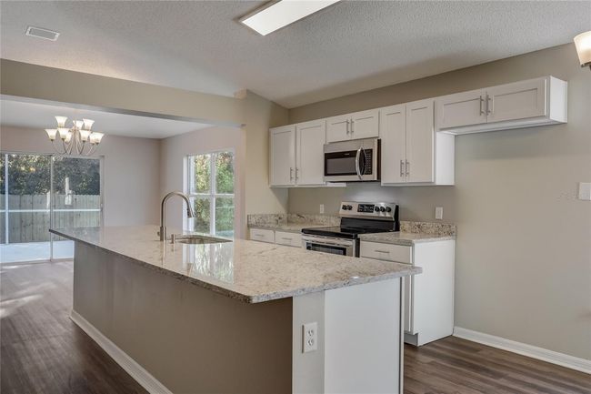 3843 Cinnamon Fern Loop, House other with 4 bedrooms, 2 bathrooms and null parking in CLERMONT FL | Image 7