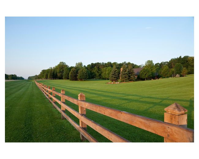 View of the fence line from the front of the property, overlooking the St. Michael House | Image 20