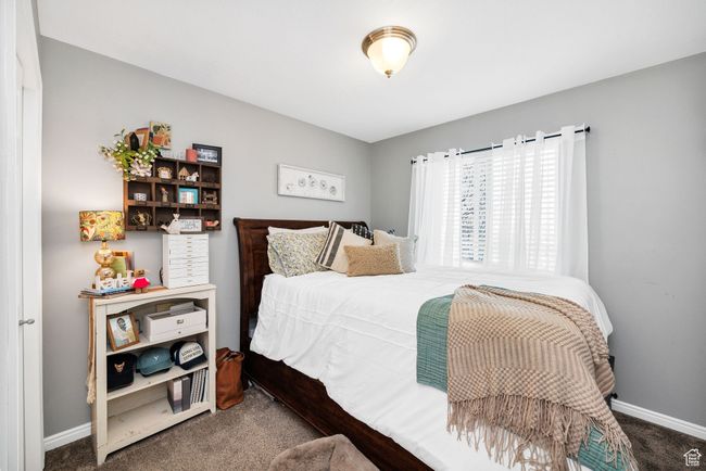 Carpeted bedroom with baseboards | Image 19
